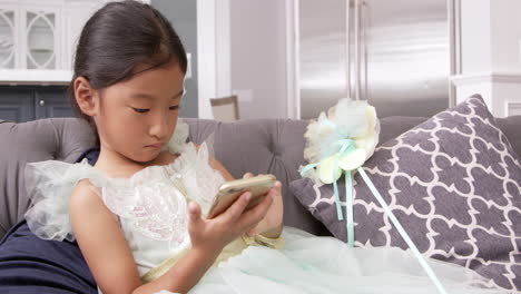 young asian girl playing game on mobile device shot on r3d