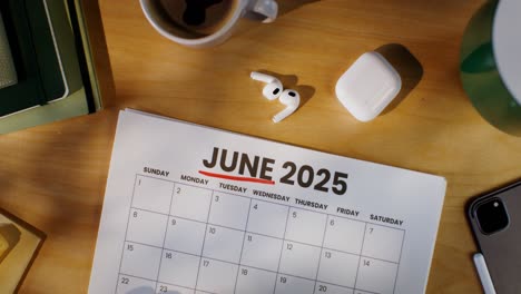 june 2025 calendar on desk