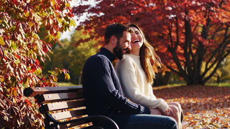 couple enjoying autumn in the park