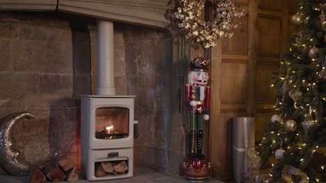 lit stove in christmas decorated lounge