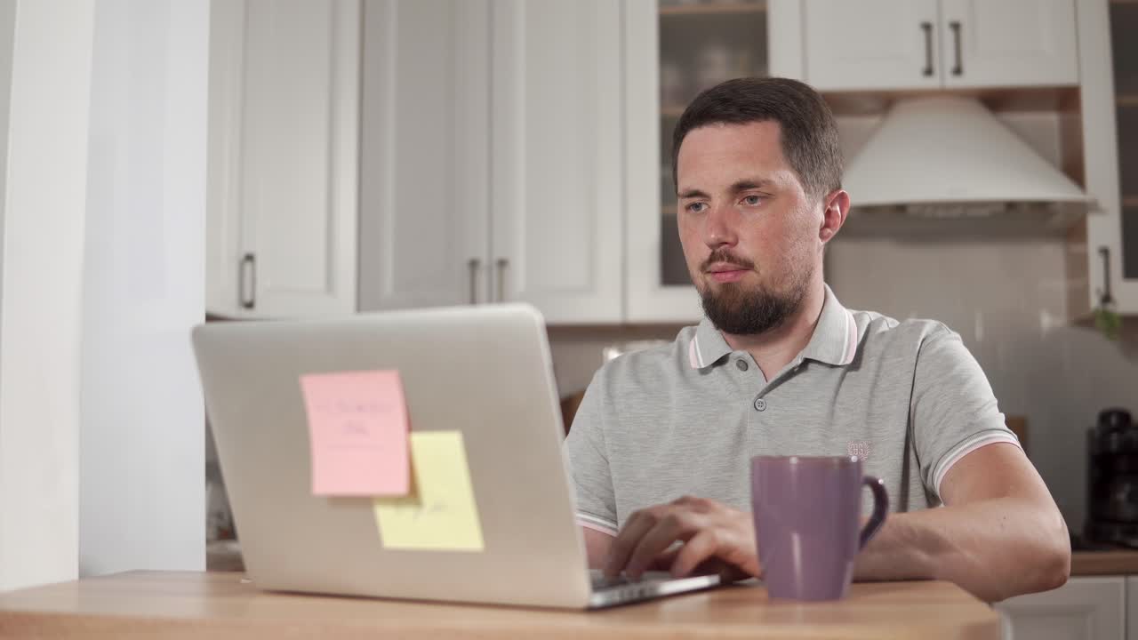 Man working from home in kitchen