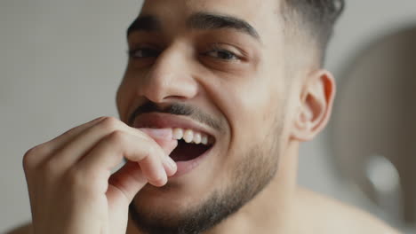 man smiling with mouth open showing teeth