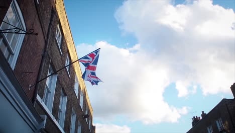 the real flag of the uk is weaving on the strong wind