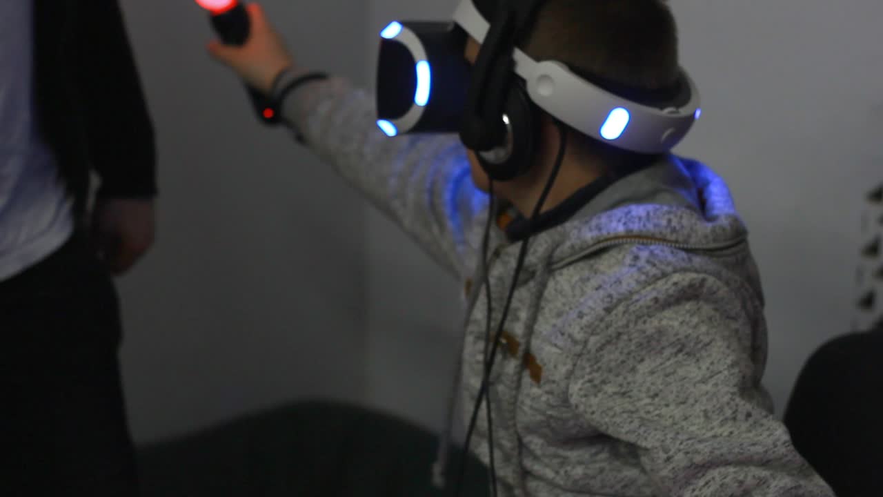 Young boy play virtual reality game. Future technology. Video game playing