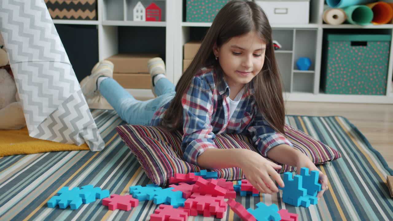 Girl Playing with Puzzles on the Floor