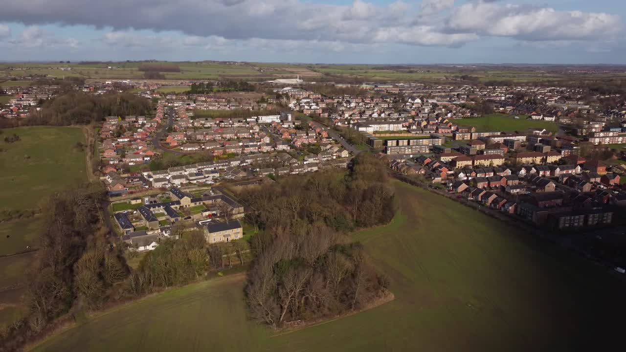 Drone circling round the bottom of Throckley Village on outskirts of Northumberland - England