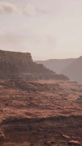 a wide shot of a red rock canyon desert landscape