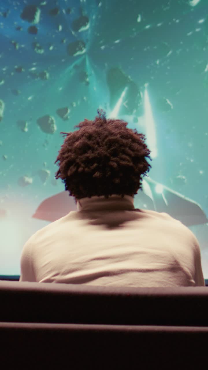 Vertical video Gamer enjoying high quality ray tracing graphics in videogame