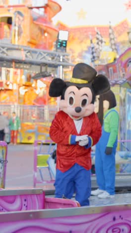 mickey mouse mascot and friends at a lively amusement park
