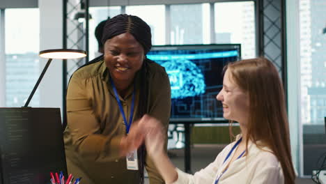 cheerful startup manager satisfied with progress of intern learning to use ai