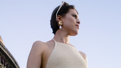 lower view of elegant woman with sunglases on her head