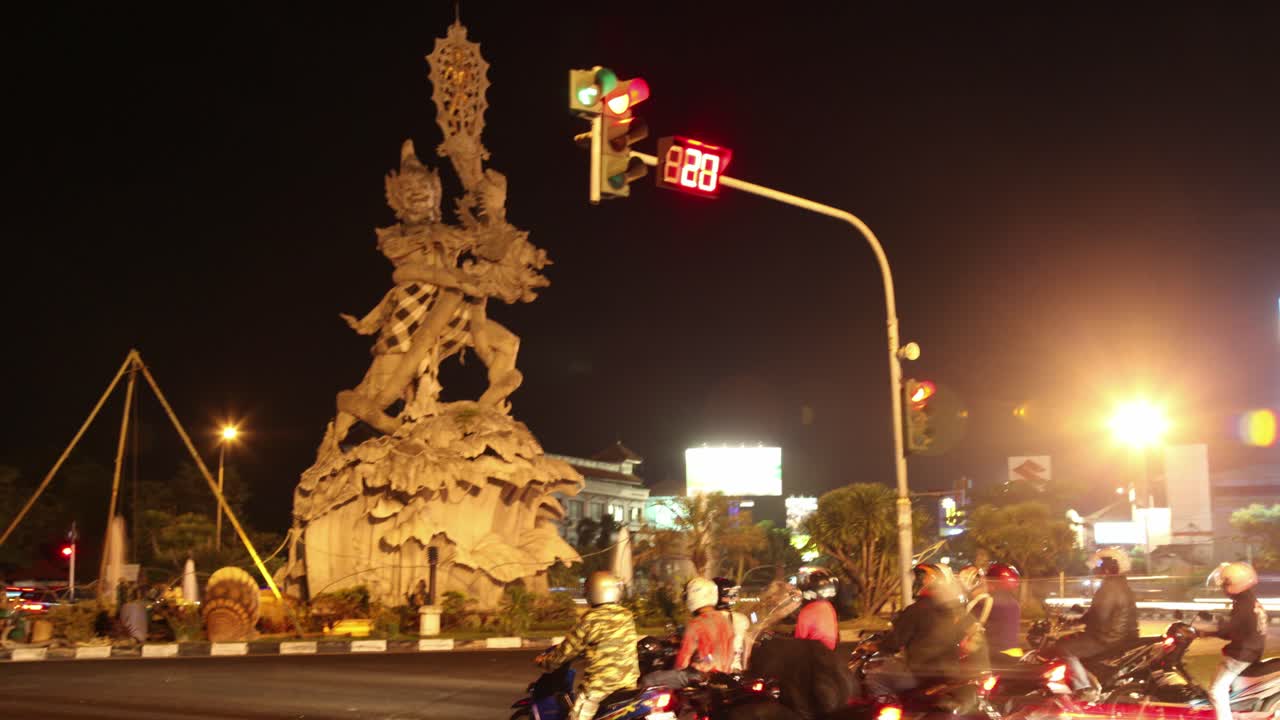 Nighttime Traffic and Monument in Indonesia