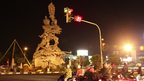 nighttime traffic and monument in indonesia