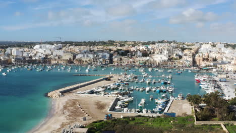 marsaxlokk fishing village in malta island in summer - aerial drone shot