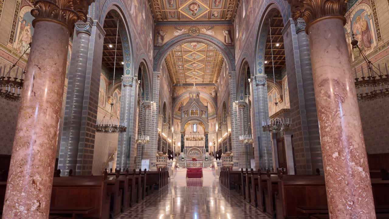 Interior view of Pécs Cathedral, showcasing its ornate altar, vaulted ceilings, and elegant architectural details