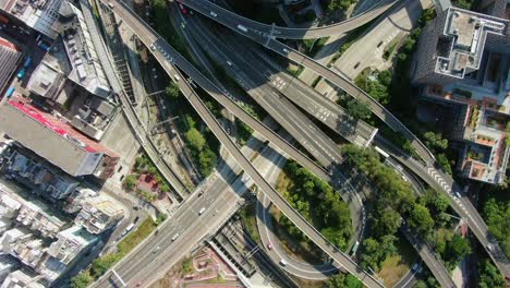 Massive-Highway-interchange-with-traffic-on-all-levels-in-downtown-Hong-Kong,-Aerial-view