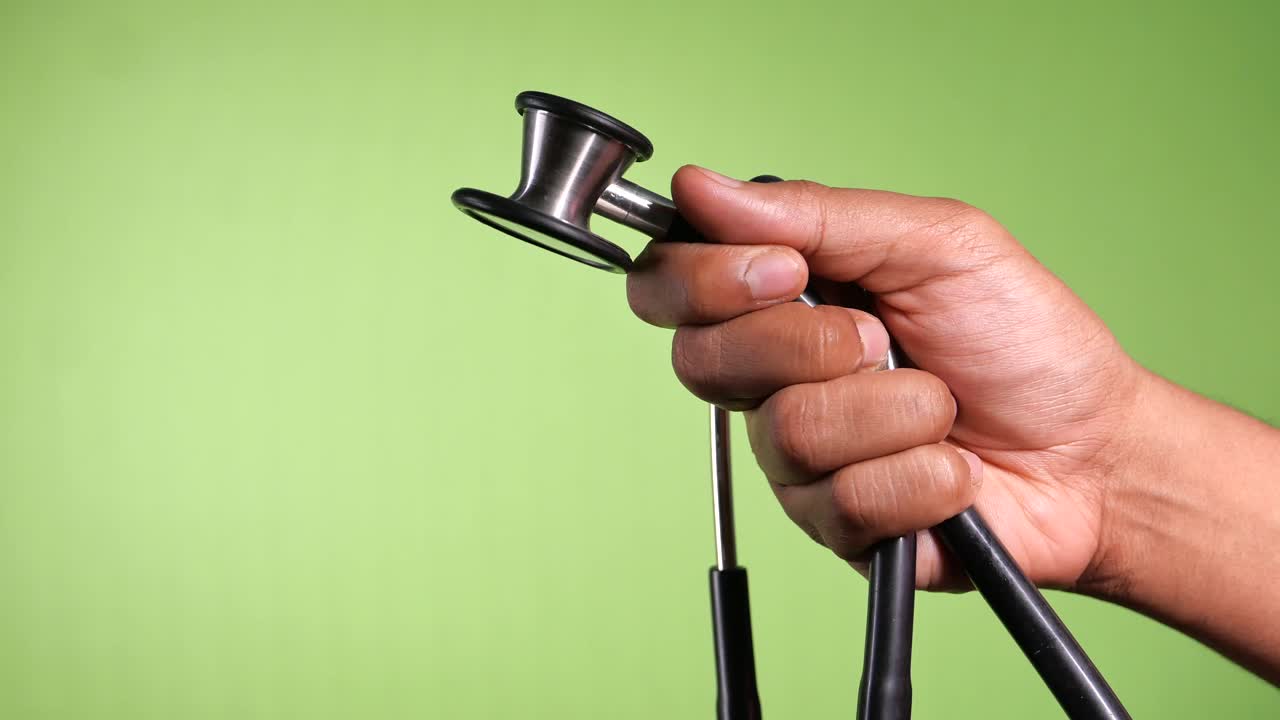 Close-up of a Hand Holding a Stethoscope
