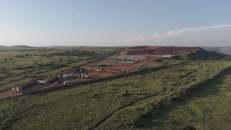 a surveying drone shot of a sizable waste processing site in the region of pretoria, south africa