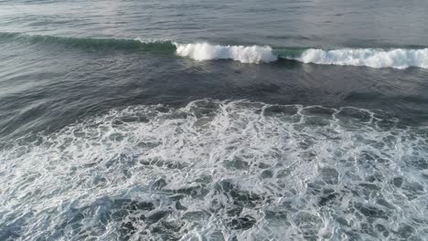 aerial view. aerial drone footage of ocean waves breaking