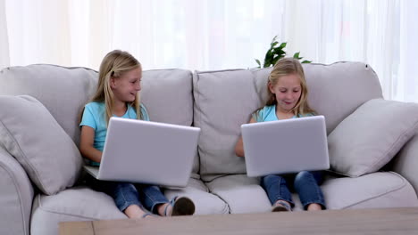 sisters using laptops