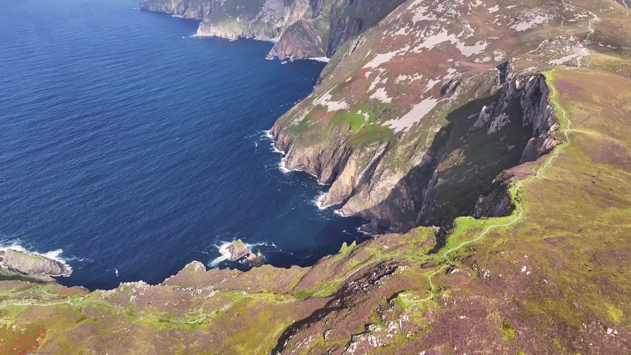Aerial cinematic reveal of The Slieve League Cliffs ( Sliabg Liag ), Donegal, Ireland