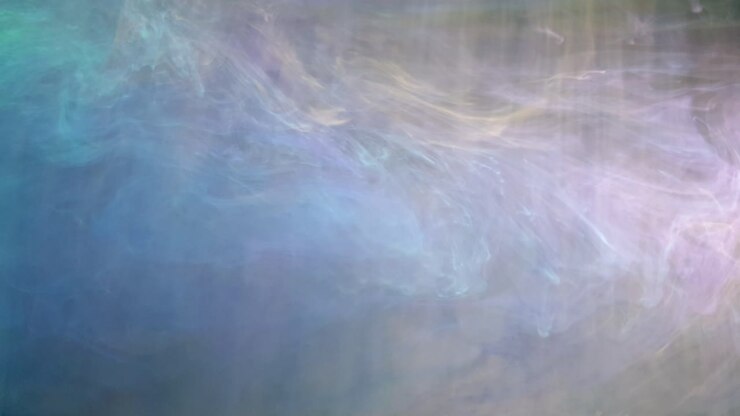 Acrylverfinkt die buitenaardse effecten creëert, prachtige veelkleurige wervelingen lijken bijna op verre ruimtenebula's met zachte pasteltinten groen, magenta en blauw.