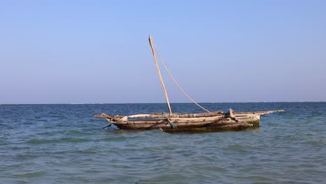 a traditional boat at diani beach - galu beach - kenya, africa