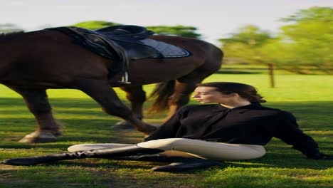 woman sitting next to a horse in a field