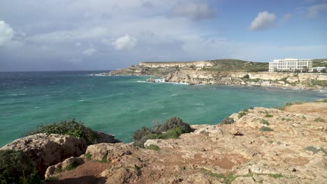 beautiful turquoise colour mediterranean sea in ghajn tuffieha bay during winter in malta