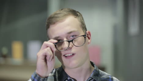 Guy in glasses smiles