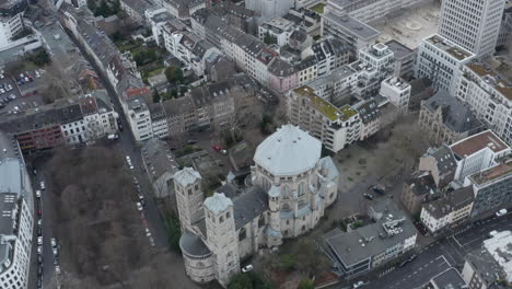 High-angle-view-of-St-Gereon-catholic-church-surrounded-by-multistorey-apartment-houses-in-urban-neighbourhood.-Cologne,-Germany