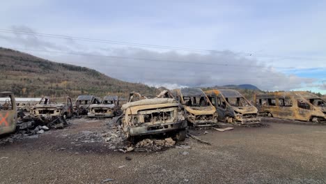 A-closeup-shot-of-rusty-demolished-sunken-cars-in-British-Columbia,-Canada