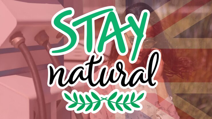 Stay natural text over flag of great britain and charging electric car