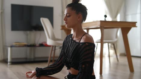 woman meditating at home