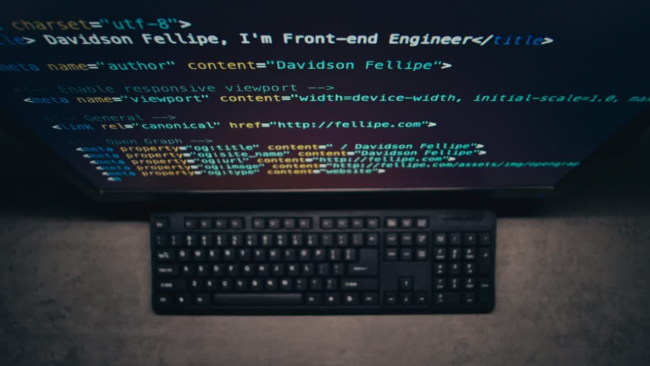 Computer Screen Displaying Code and Keyboard