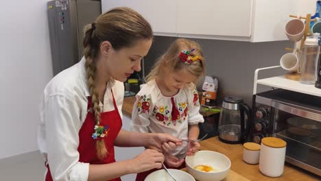 mother and daughter cooking together