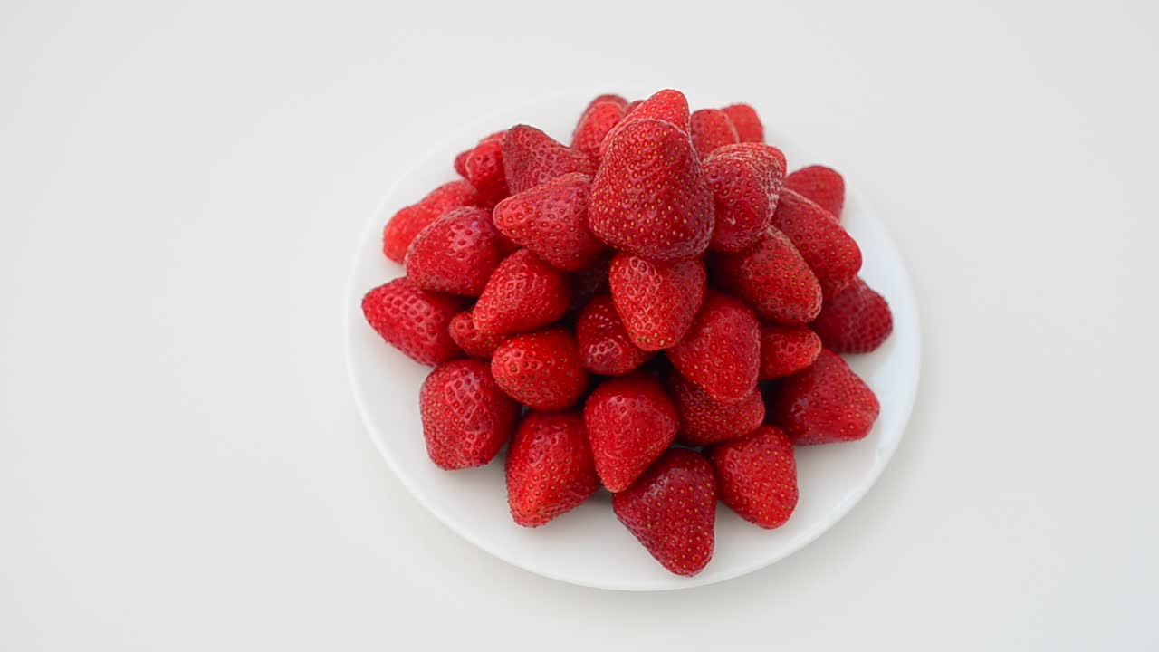 Strawberry on a white background, isolate. Shooting in the movement