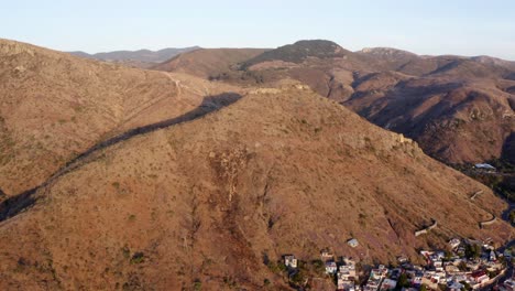 Wide-aerialing-above-arid-mountainous-landscape-in-New-Mexico,-4K