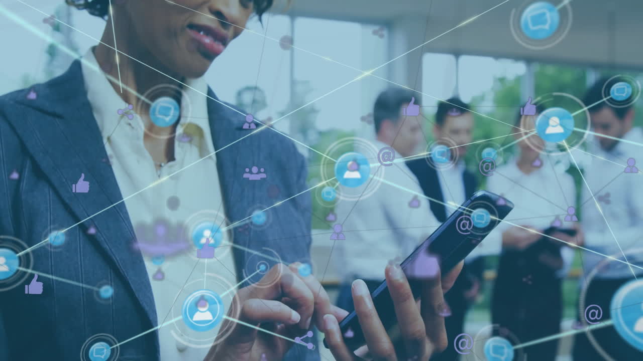 Animation of network of connections with icons over african american businesswoman using smartphone