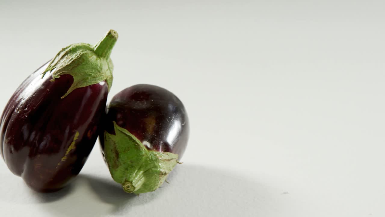 Eggplants on a white background 4k