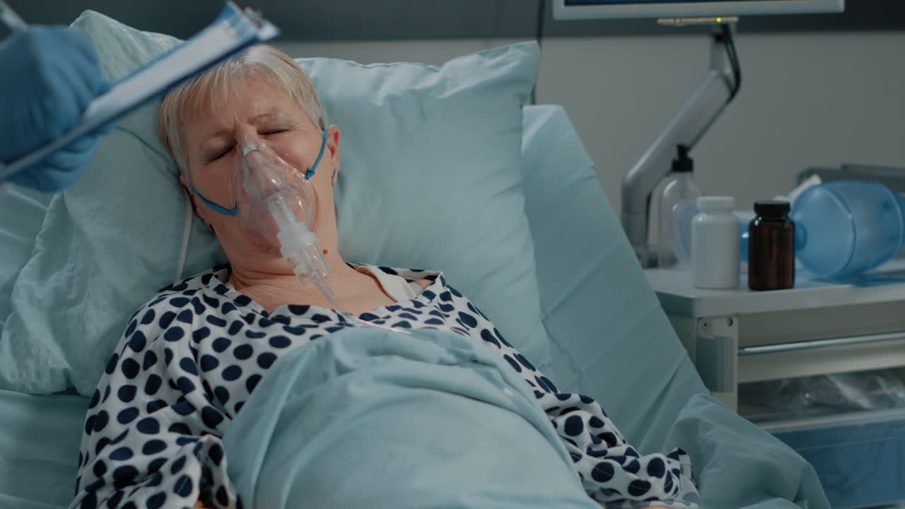 Aged woman with coronavirus symptoms wearing oxygen mask