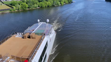 uxury ferry with swimming pool and helipad floats along river view from the