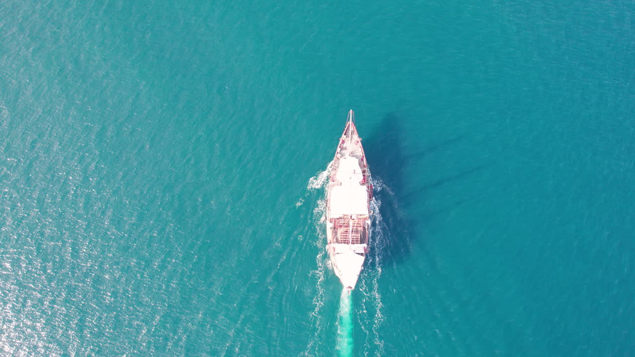 Beautiful pirate-style wooden boat navigating the turquoise waters off the coast of Puerto Vallarta