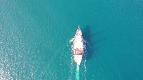 beautiful pirate-style wooden boat navigating the turquoise waters off the coast of puerto vallarta