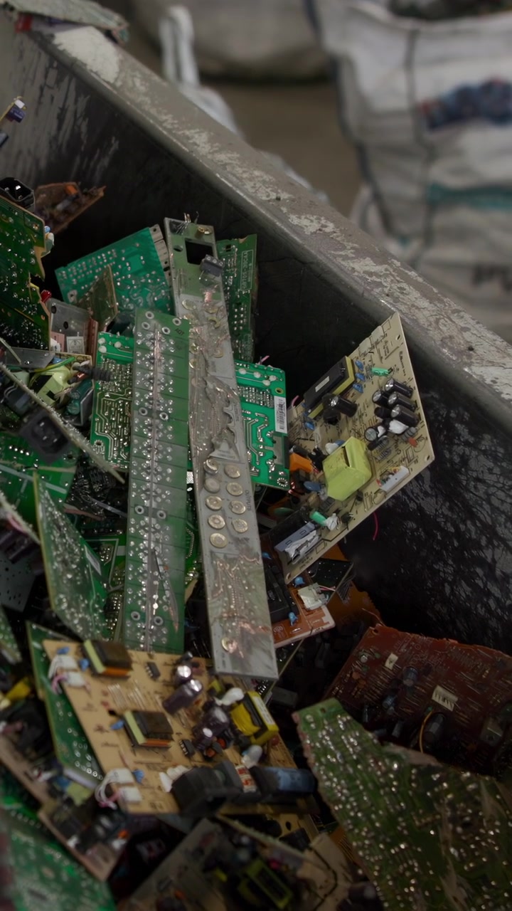 Piles Circuit Boards In Industrial Hopper, Dusty Green Pcbs Stacked With Wires And Components, Closeup