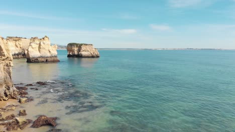 Algarve-stunning-Limestone-Cliffs-scattered-through-Lagos-Coastline,-Portugal---Aerial-Fly-over-shot