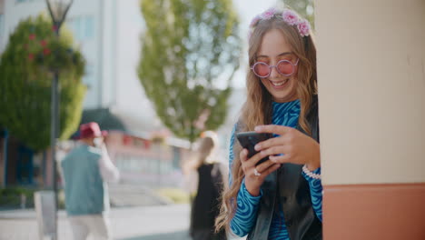 young woman using smartphone outdoors