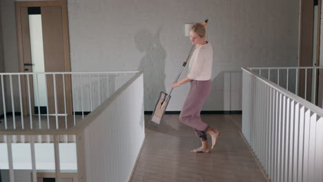 woman mopping a modern home