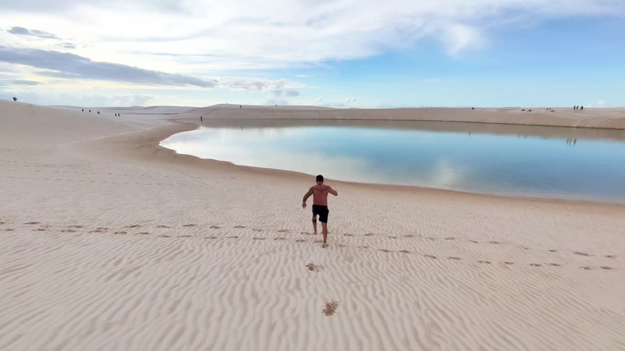 Running in slow motion in the blue lagoon of the Lencois Maranhenses