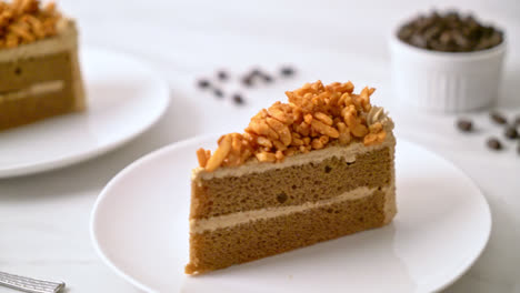 homemade coffee almonds cake on white plate